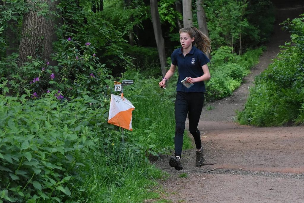 Young orienteer connecting with nature in Scotland