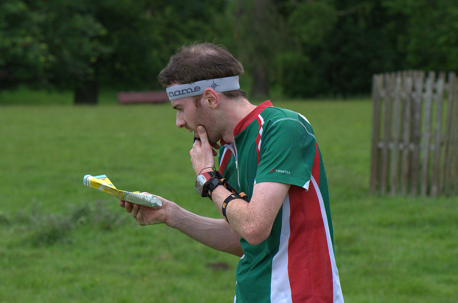 Orienteer reading map on adventure sport in the great outdoors