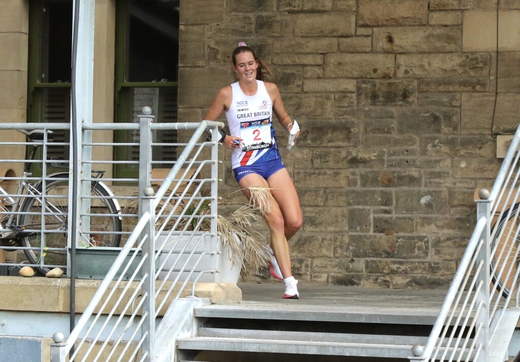 Grace Molloy running through a courtyard in Edinburgh